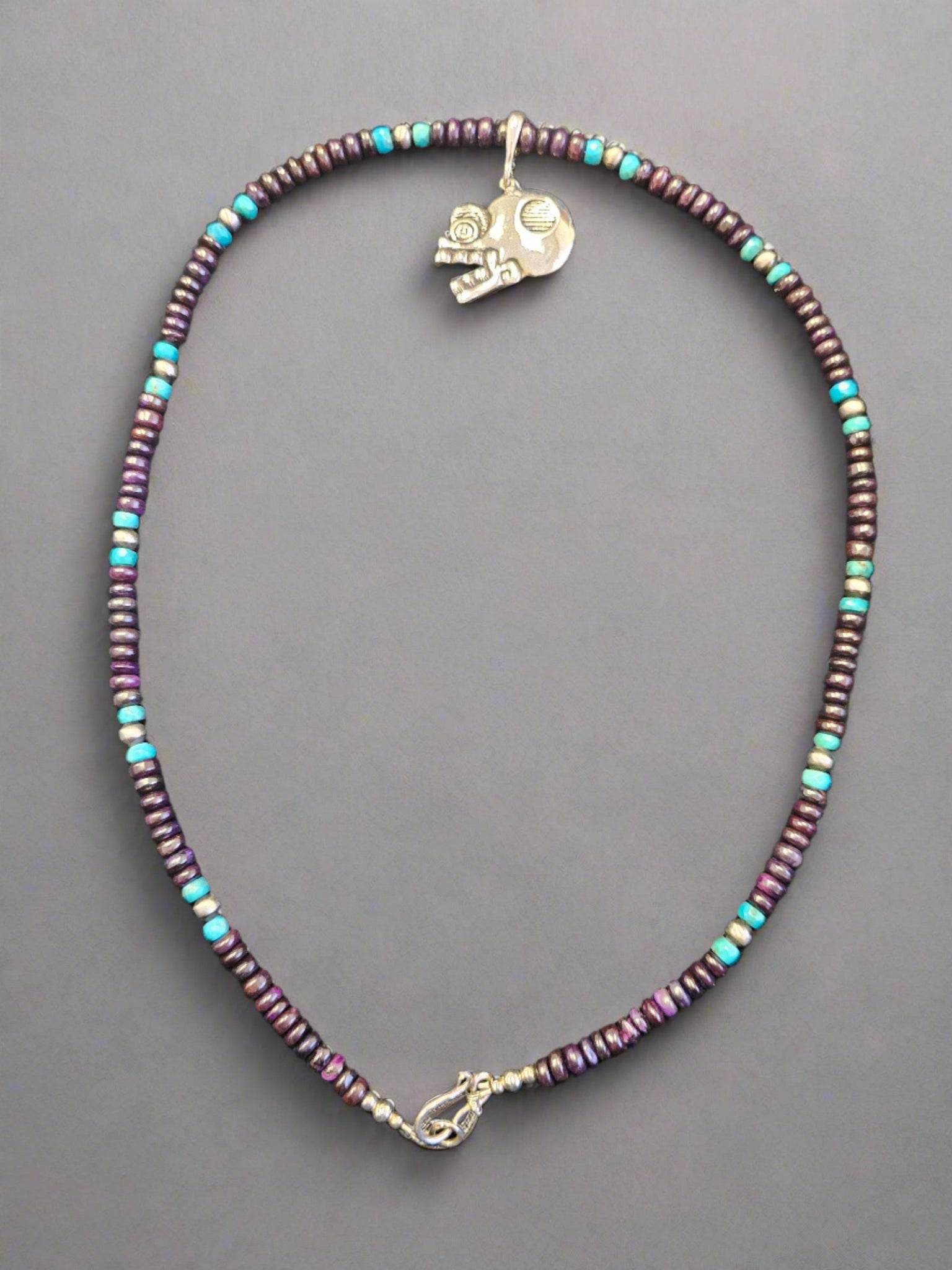 Calaca Enhancer Bail Pendant on 22-inch Sugelite, Turquoise, and Silver Bead Necklace